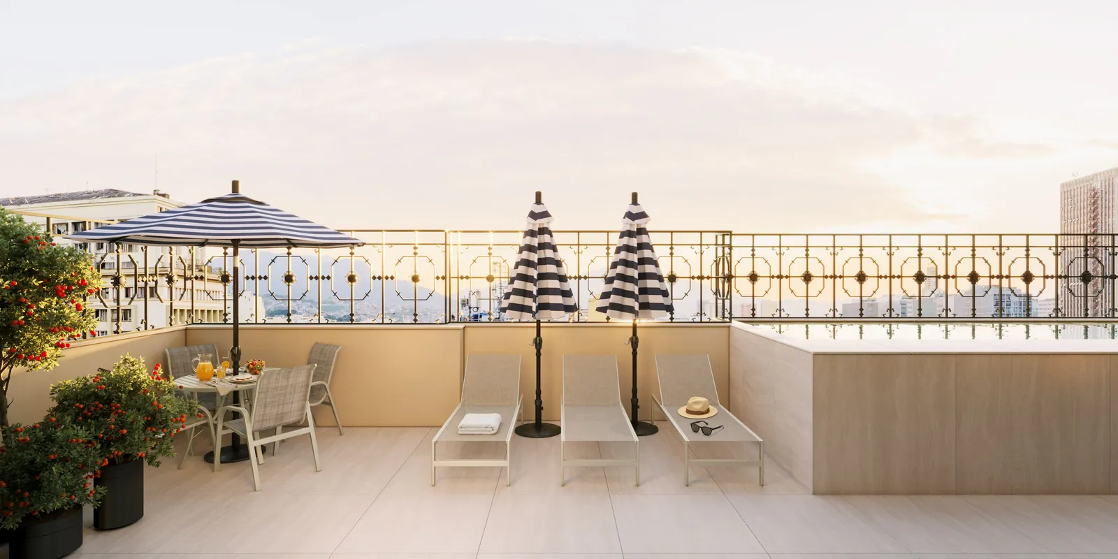 Piscina do rooftop com deck e espreguiçadeiras ao entardecer